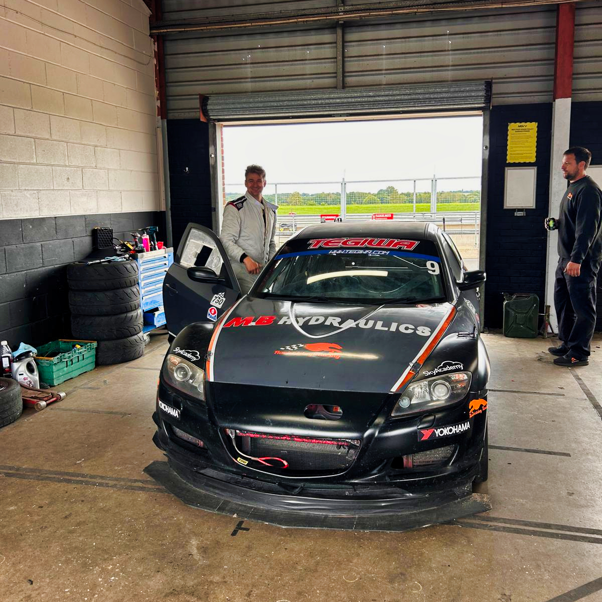 Luke Beardmore in garage at snetterton with race car